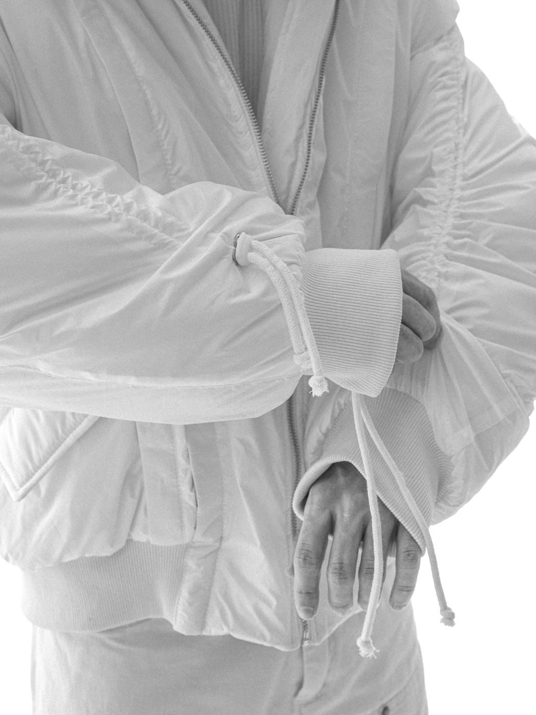 White bomber sleeves, close-up