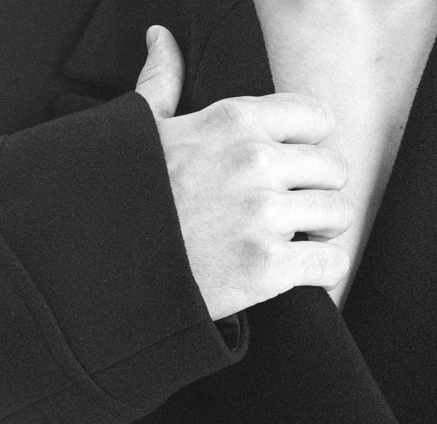 Hand on a coat lapel